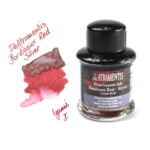 Bottle and swatch of De atramentis bordeaux red silver ink