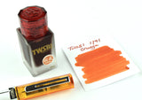 18ml bottle of  orange 1791 ink made by TWSBI with TWSBI Eco fountain pen.